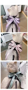Detail of pet harness with large satin bow, lace trim, and heart rhinestone accent