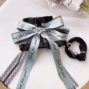 Adjustable pet harness and leash set with blue lace bow and heart rhinestone detail