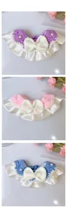 Three-piece handmade knitted pet bibs with large white bows and lace trim in cream style