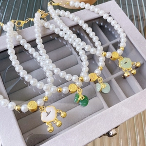 Chinese style pet pearl collar with faux jade pendants and gold Fu character charms