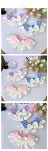 Detailed macro view of handmade knit pet collar with soft lace and pearl bow decoration