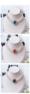 Double-layer pet pearl necklace with large emerald-cut gemstones in red blue and green