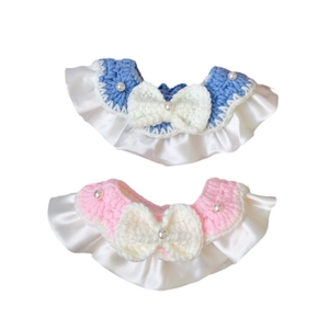 Handmade knitted pet collar with bow and pearl detail in pink and blue colors