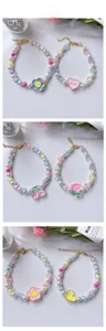 Detail of adjustable beaded pet necklaces featuring cute flower and duck pendants