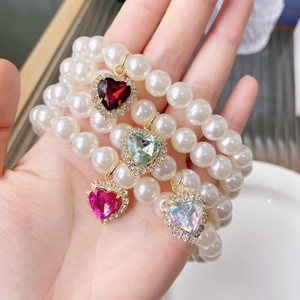 Elegant pearl pet necklace with heart-shaped diamond pendant in four vibrant colors