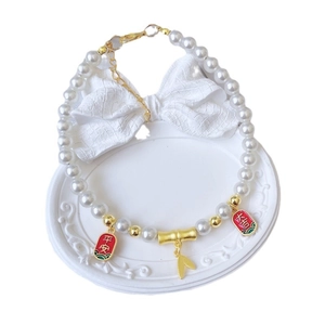 Elegant pet pearl necklace with gold bamboo pendant and red safety charms for dogs and cats