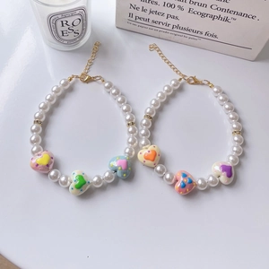 Charming beaded pet necklace with white faux pearls and colorful hand-painted heart pendants