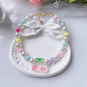 Adjustable pet necklace with pearls, colorful beads, and a cute pink rabbit cherry charm