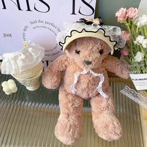 Detailed view of handmade lace pet sun hat with woven straw texture and delicate bow