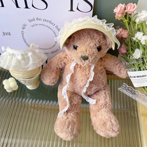 Detail of hand-woven pet straw hat and delicate white lace collar for cats and dogs