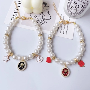 Elegant pearl pet necklace with rose pendant and moon charms for dogs and cats