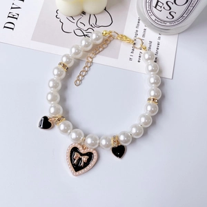 Elegant pet pearl collar with gold rose pendant and vintage heart charms for cats and dogs
