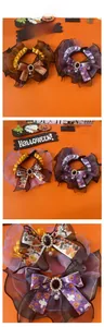Detail of Halloween pet lace collar with mesh ruffles, pearl charms and festive patterns
