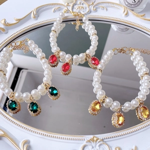 Sparkling pet pearl necklace set with emerald, ruby, and citrine gemstone pendants