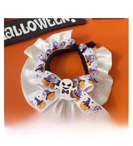 Detail of Halloween pet collar featuring white ruffles and a cute ghost resin ornament