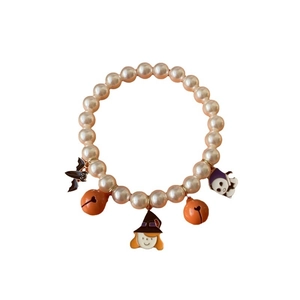 Halloween pet pearl collar with pumpkin bells, ghost and bat charms on white background