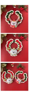 Detail view of handmade crochet Christmas pet scarves with snowman and star patterns