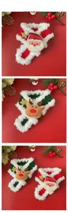 Detail of hand-knitted Christmas pet scarves featuring Santa and Reindeer plush figures