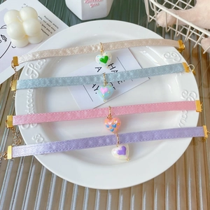 Hand-painted heart pendant pet collars in four pastel colors with adjustable gold chains
