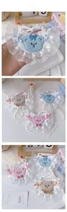 Detail of crochet pet bib with lace trim and bear design for cats and small dogs