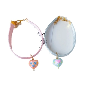 Pink and blue heart-shaped pet collars with sparkling dots and adjustable metal chains