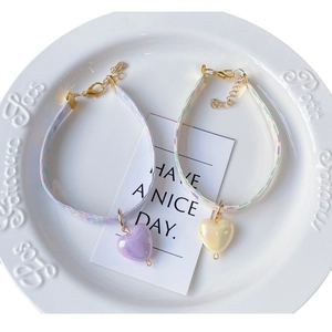 Sweet heart print pet collars with gold buckle and pearlescent heart charms in a set of two