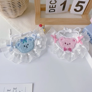 Handmade crochet pet bib with cute bear pattern and lace trim in pink and blue