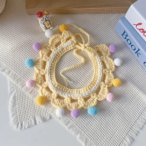 Handmade knitted yellow pet collar with colorful pom-poms for cats and dogs