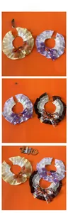 Detailed view of Halloween pet lace collars with pumpkin bows in yellow, purple and black