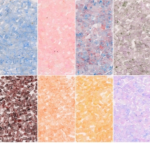 Macro shot of assorted colorful triangular glass beads for DIY jewelry and necklaces