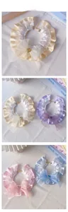 Detail of adjustable pet lace collars with layered ruffles and heart rhinestone bows
