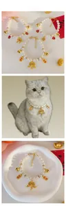 Detail of pet pearl collar with golden fortune lock pendant and bell for cats and dogs