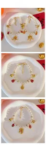 Detail of pet pearl necklace with golden Chinese fortune lock and bells for New Year