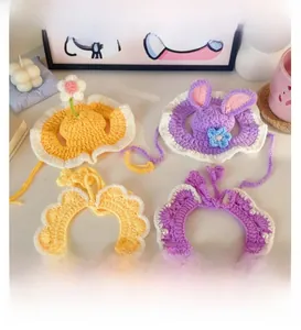Detailed set of handmade crochet pet hats with rabbit ears and pearl-beaded collars