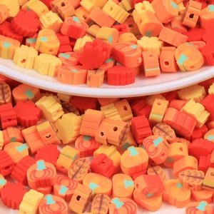 DIY mixed polymer clay beads set featuring autumn maple leaves and pumpkins for jewelry making