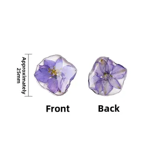 Close-up of 25mm purple dried flower resin charm showing front and back views