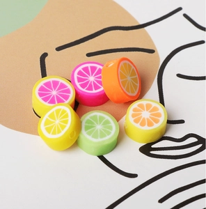 Macro shot of colorful fruit-themed polymer clay beads for DIY jewelry making