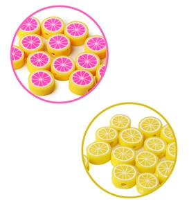 Detailed view of handmade grapefruit polymer clay beads with pre-drilled holes for DIY jewelry
