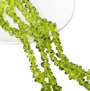 Macro detail of irregular olive green glass beads for DIY jewelry making and bracelets