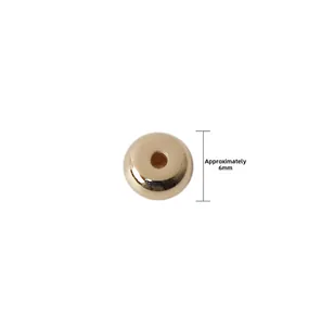 Detailed macro view of 6mm golden CCB flat round spacer beads for jewelry making