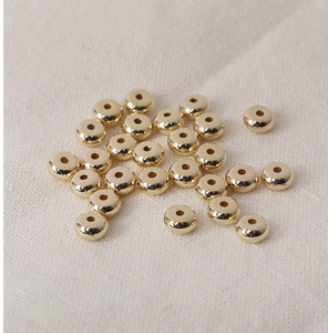 Scattered golden flat round CCB spacer beads with metallic luster for DIY jewelry making