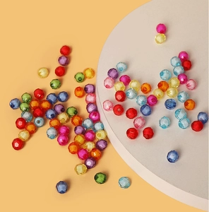Macro shot of colorful faceted acrylic beads for DIY jewelry and necklace crafting