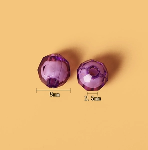 Macro detail of 8mm purple acrylic faceted beads showing 2.5mm hole for DIY jewelry making