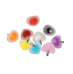 Detailed view of colorful frosted acrylic heart pendants with silver metal loops for DIY jewelry