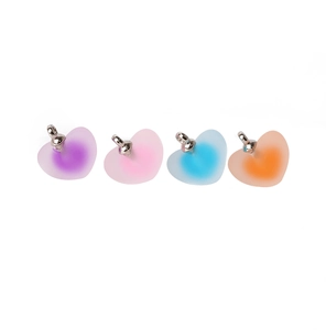 Close-up of heart-shaped frosted gradient acrylic charms in four colors for DIY jewelry