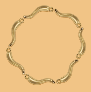 Detailed view of seven gold-plated cornicello horn pendants for DIY jewelry making