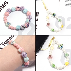 Handmade striped ceramic pumpkin beads bracelet and butterfly charm phone strap set