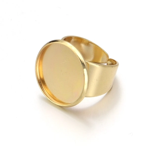 Macro view of adjustable brass ring base with flat circular tray for DIY jewelry making