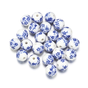 Macro detail of round ceramic beads with classic blue and white floral porcelain patterns