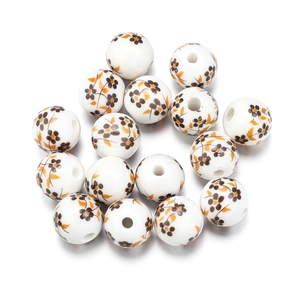 Macro shot of 8mm round ceramic beads with vintage floral patterns for DIY jewelry making